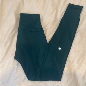 Like New teal colored Wunder Train leggings in a size 4. 28” lengthh.